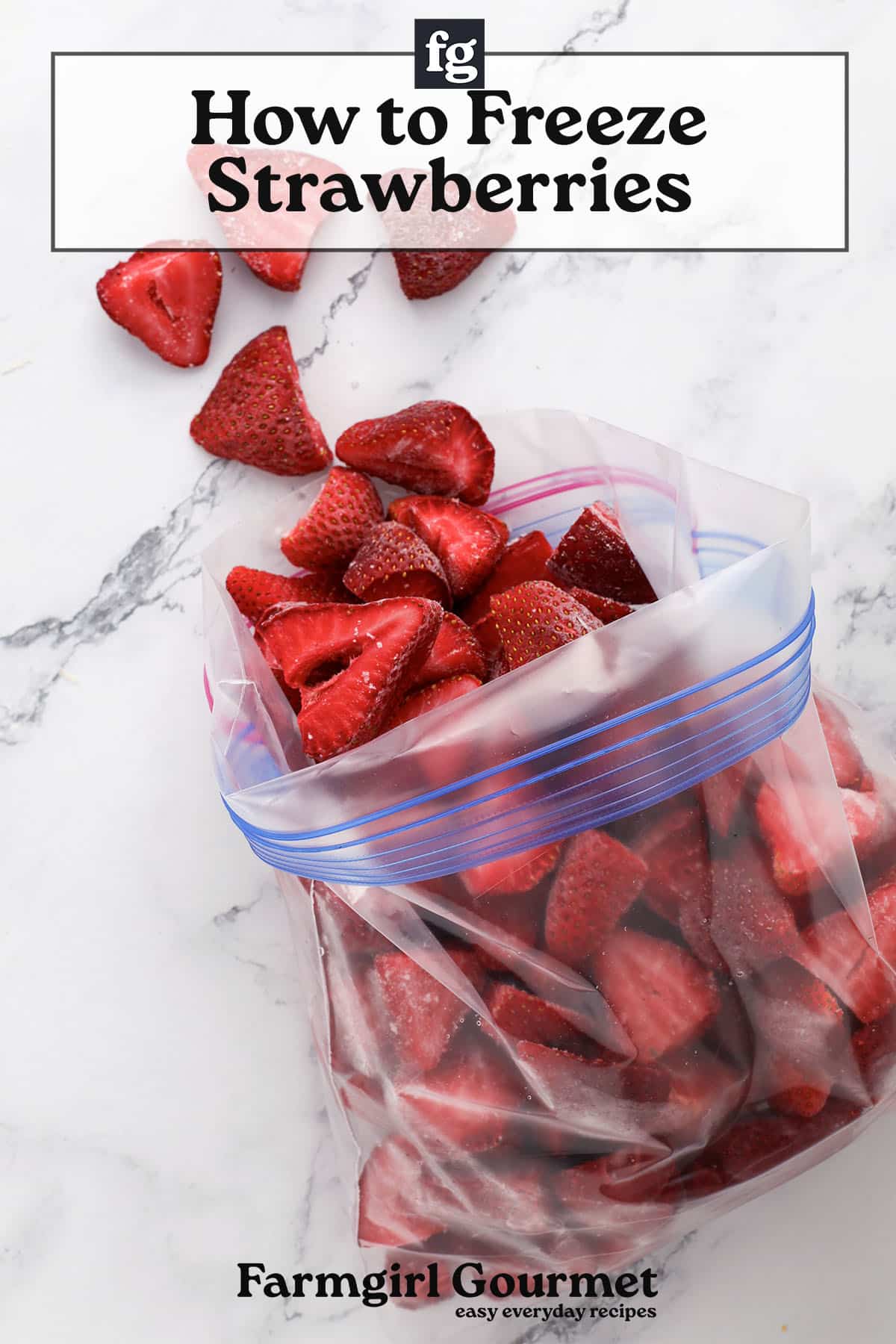 A resealable plastic bag filled with sliced strawberries sits on a marble surface, with a few strawberry pieces scattered beside it. Text reads How to Freeze Strawberries and Farmgirl Gourmet.