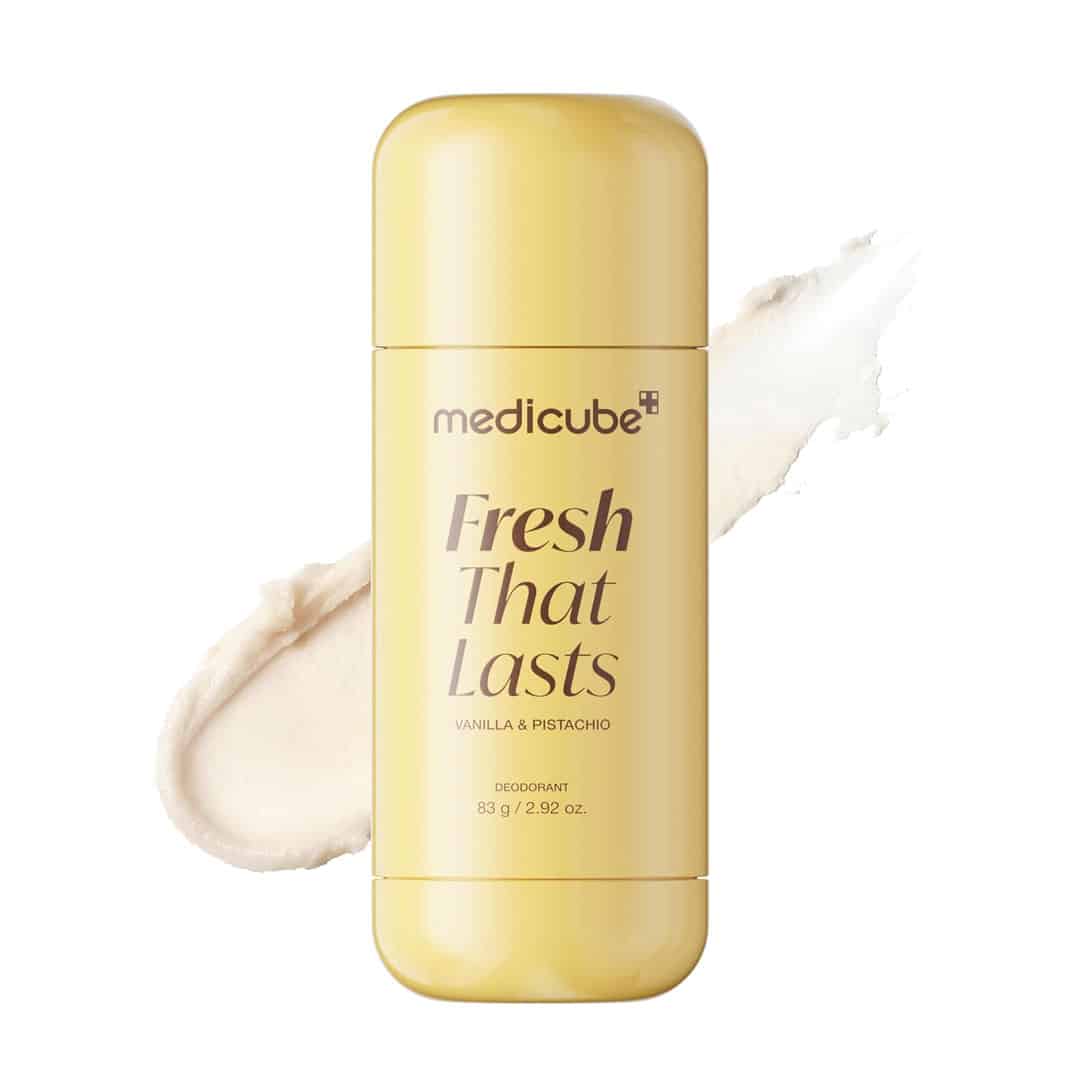 A yellow medicube deodorant stick labeled Fresh That Lasts, Vanilla & Pistachio, with a beige smear of the product shown beside it on a white background.