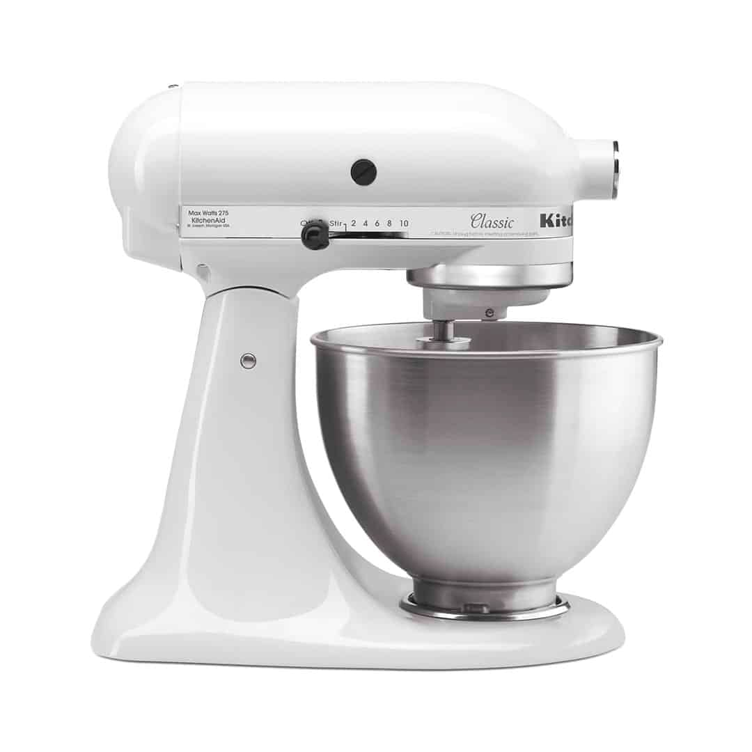 A white KitchenAid stand mixer with a stainless steel mixing bowl, shown from the side on a plain white background—the perfect companion for following the ultimate homemade bread guide.