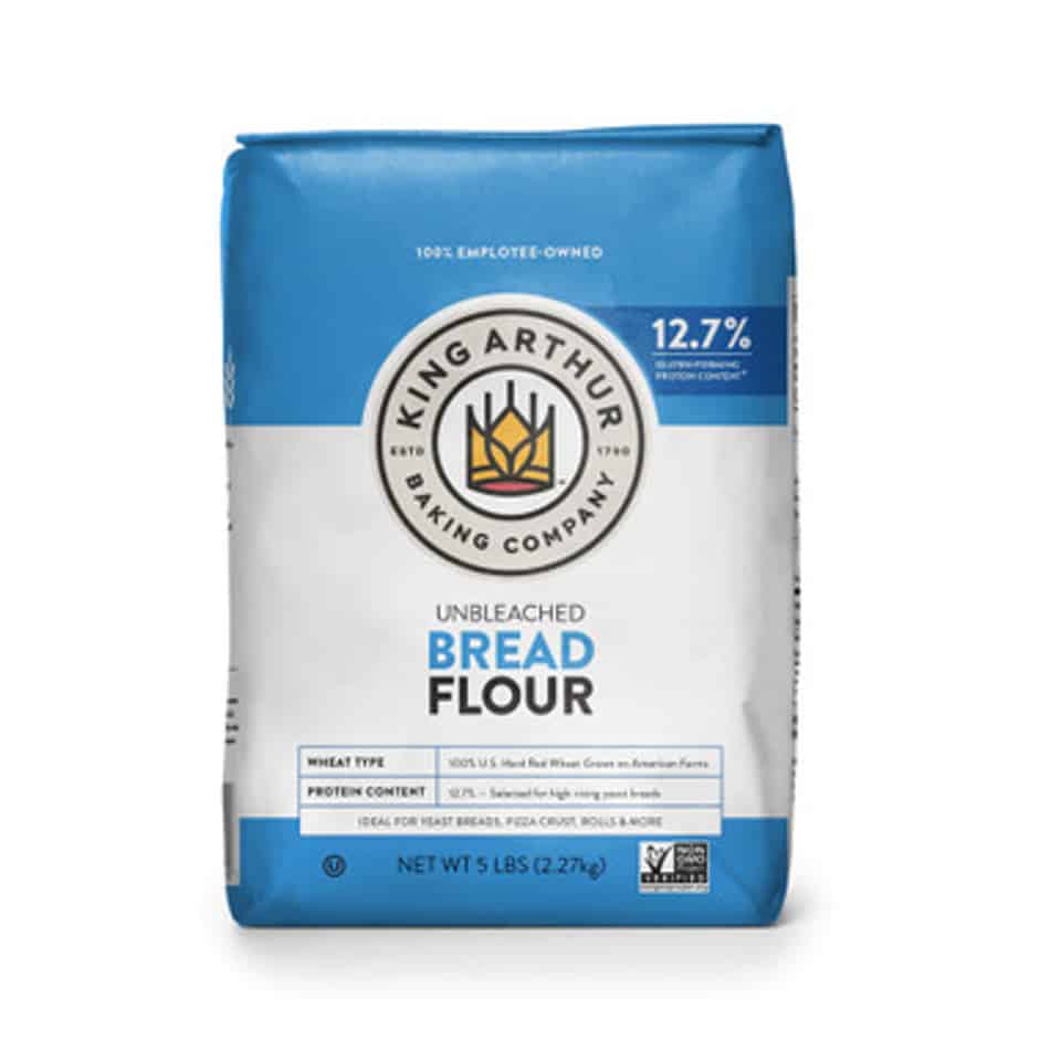 A 5-pound bag of King Arthur Unbleached Bread Flour, with white and blue packaging, labeled 12.7% protein—an essential ingredient featured in the ultimate homemade bread guide, perfect for yeast breads, pizza crusts, and rolls.